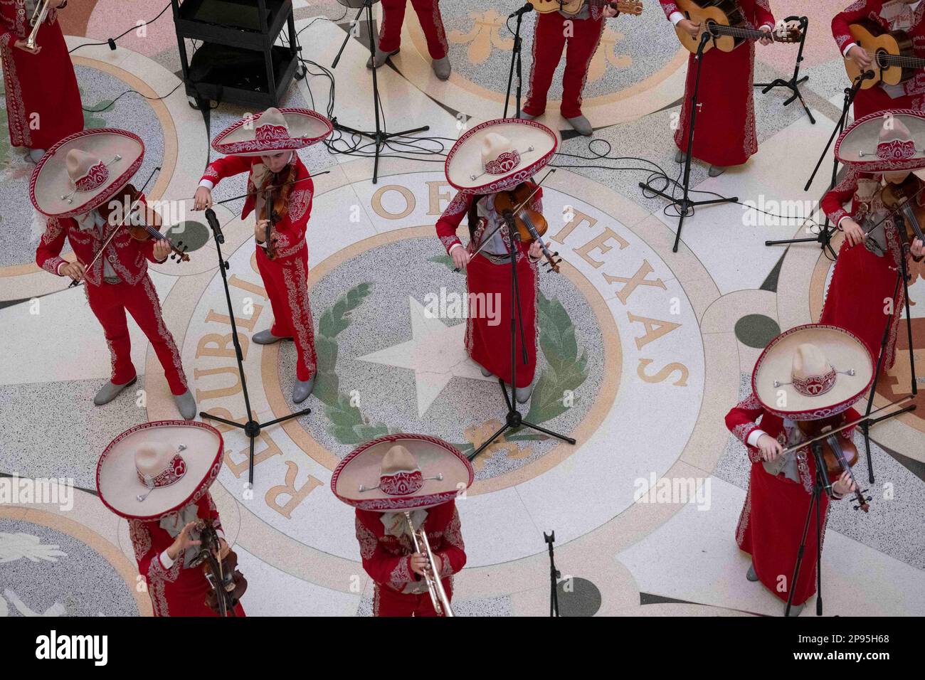 A high school mariachi from Starr County, Texas performs a noontime concert in the Texas Capitol Rotunda on March 7, 2023.  Mariachi is a type of traditional Mexican folk music, typically performed by a small group of strolling musicians dressed in native costume, and is especially popular  in south Texas, where high school groups often perform in competitions. ©Bob Daemmrich Stock Photo