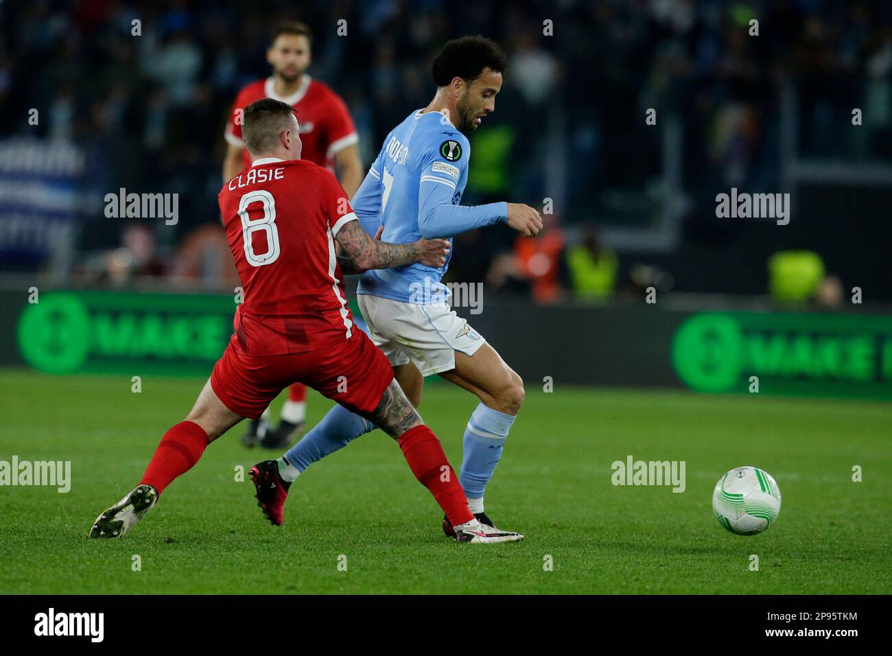 Alkmaar Zaanstreek's Dutch midfielder Jordy Clasie challenges for the ball with Lazio's Brazilian forward Felipe Anderson during the round of 16 UEFA Conference league first match between SS Lazio vs Alkmaar Zaanstreek. AZ Alkmaar won 2-1 Stock Photo