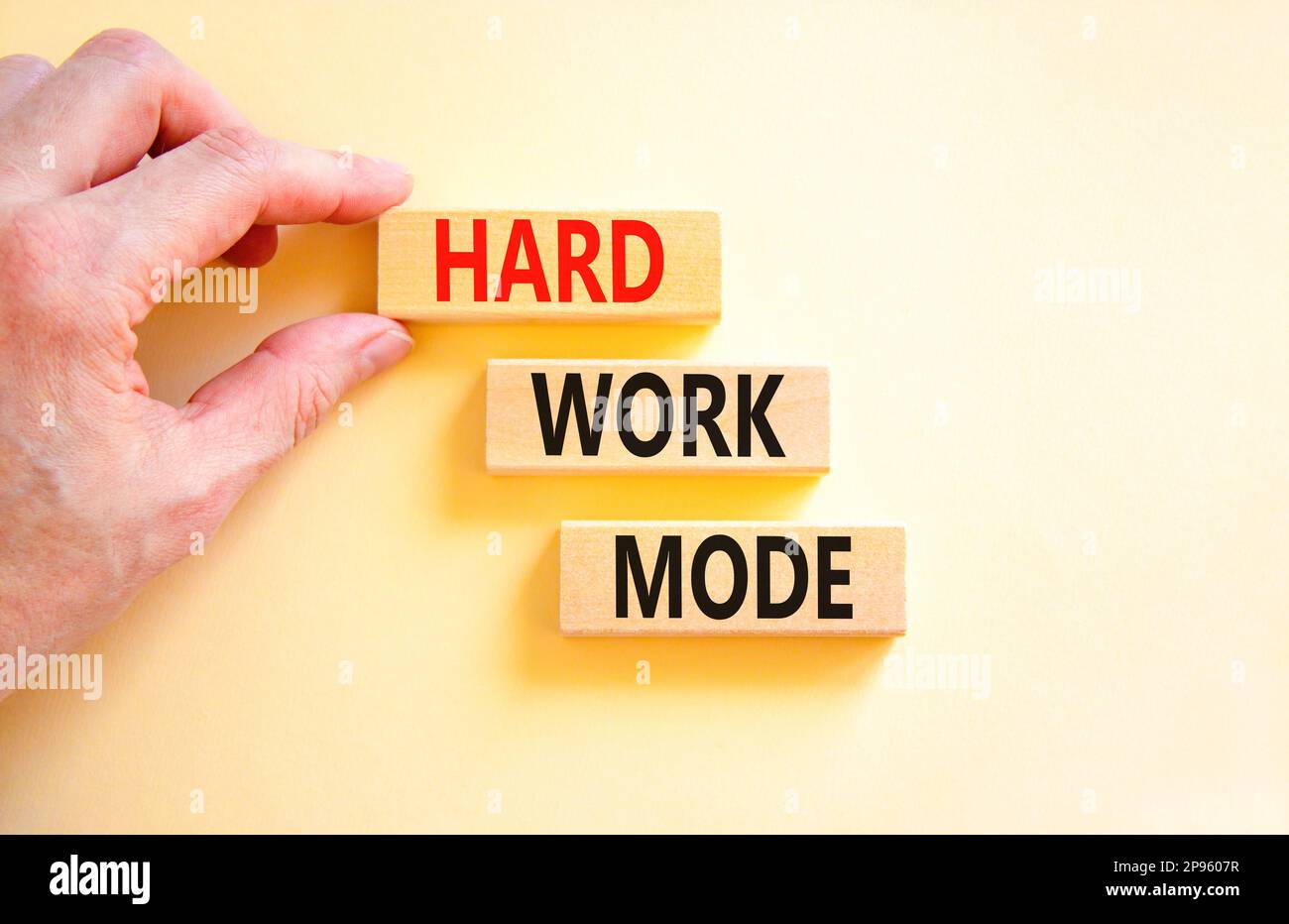 Hard work mode symbol. Concept words Hard work mode on wooden block on ...