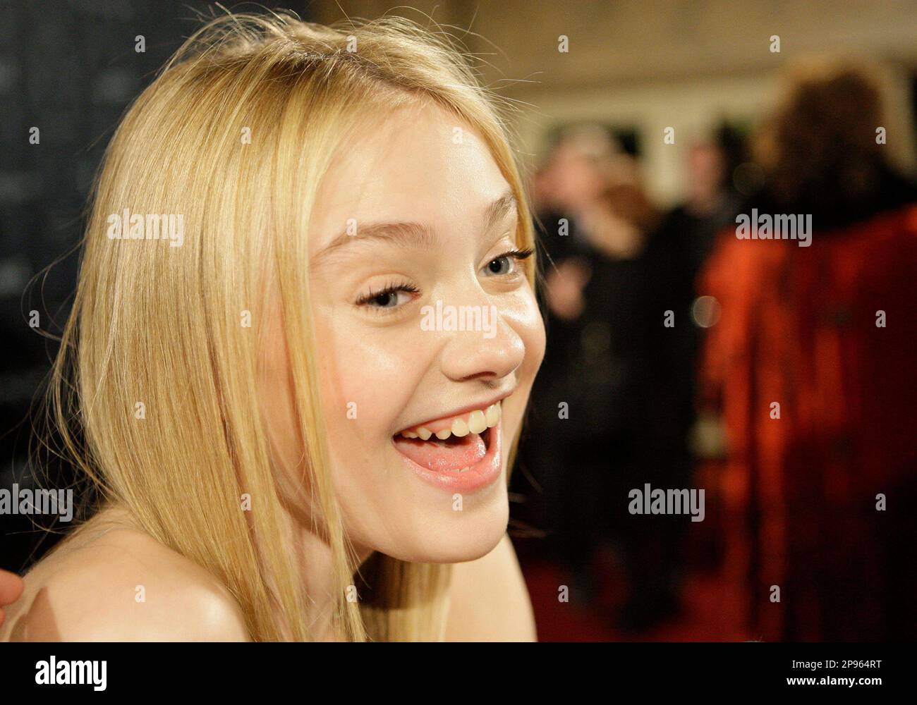 Dakota Fanning, voiceover cast member for Coraline, is seen on the red