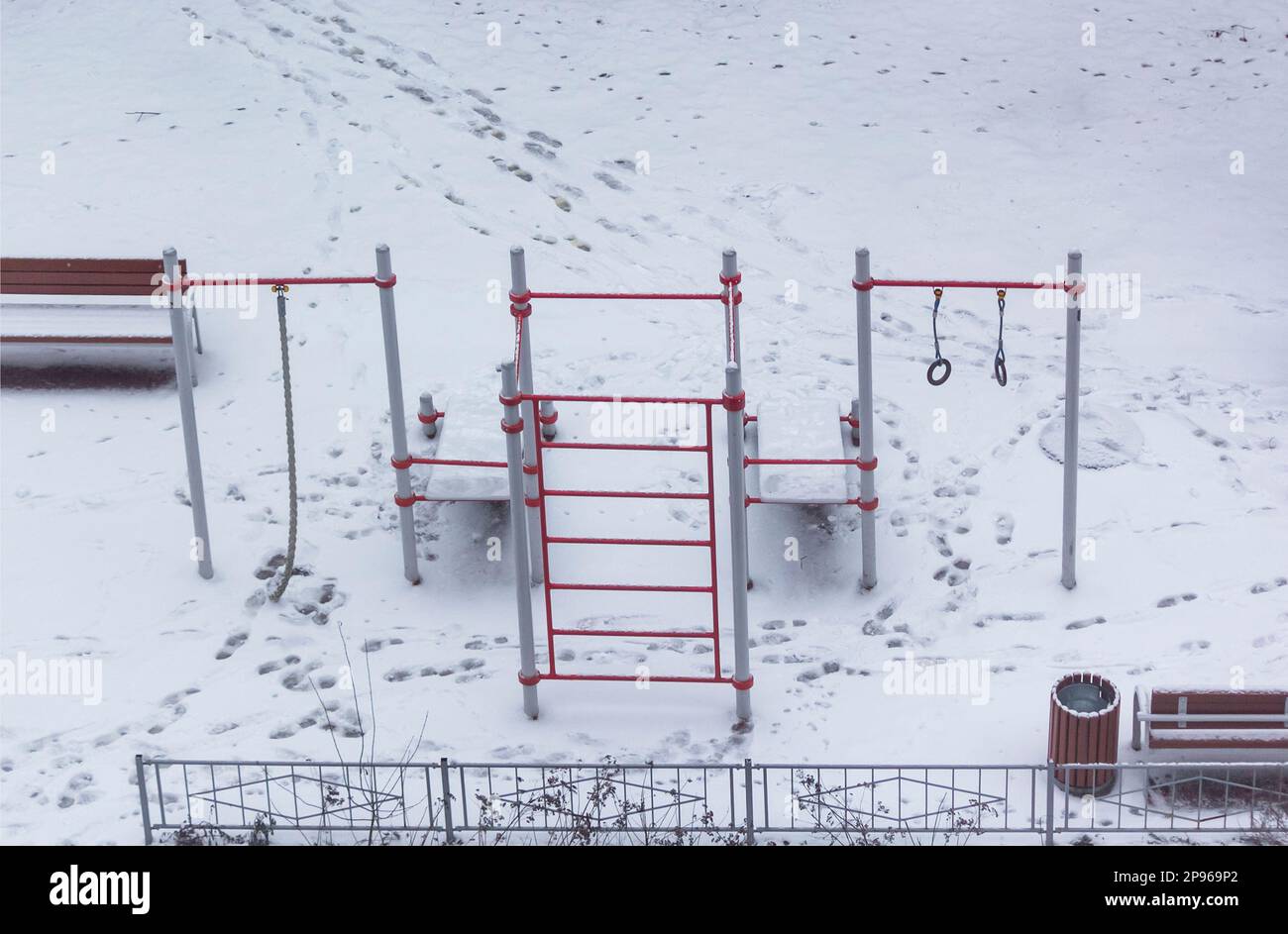 Horizontal bar on a street sports ground littered with snow in winter Stock Photo