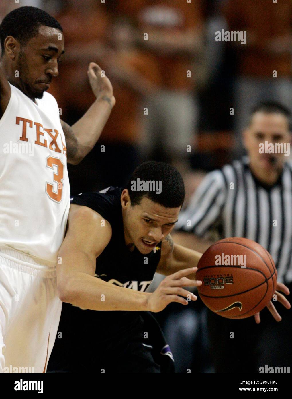 Kansas State guard Denis Clemente, right, is fouled by Texas guard A.J