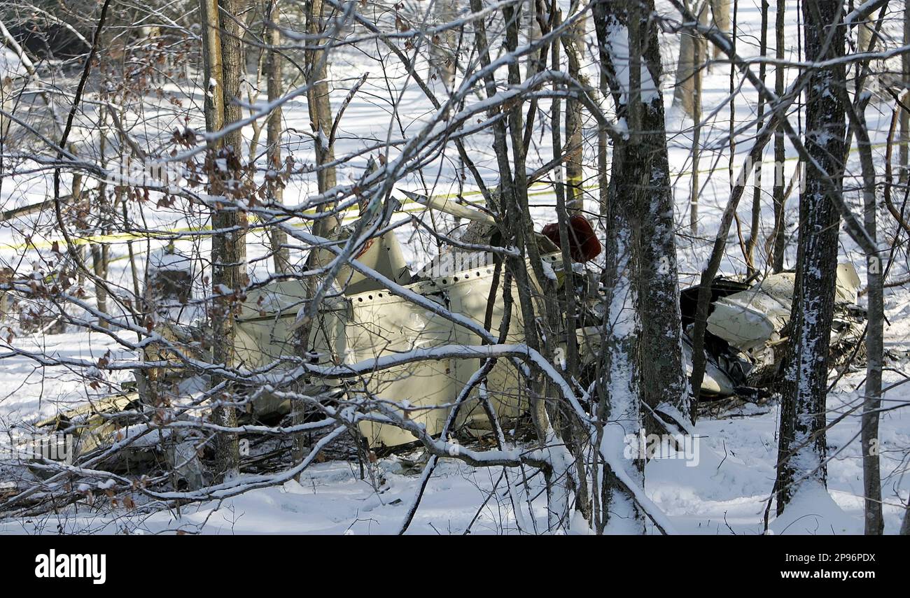 The wreckage of a twinengine Piper Seneca PA34 lies twisted among