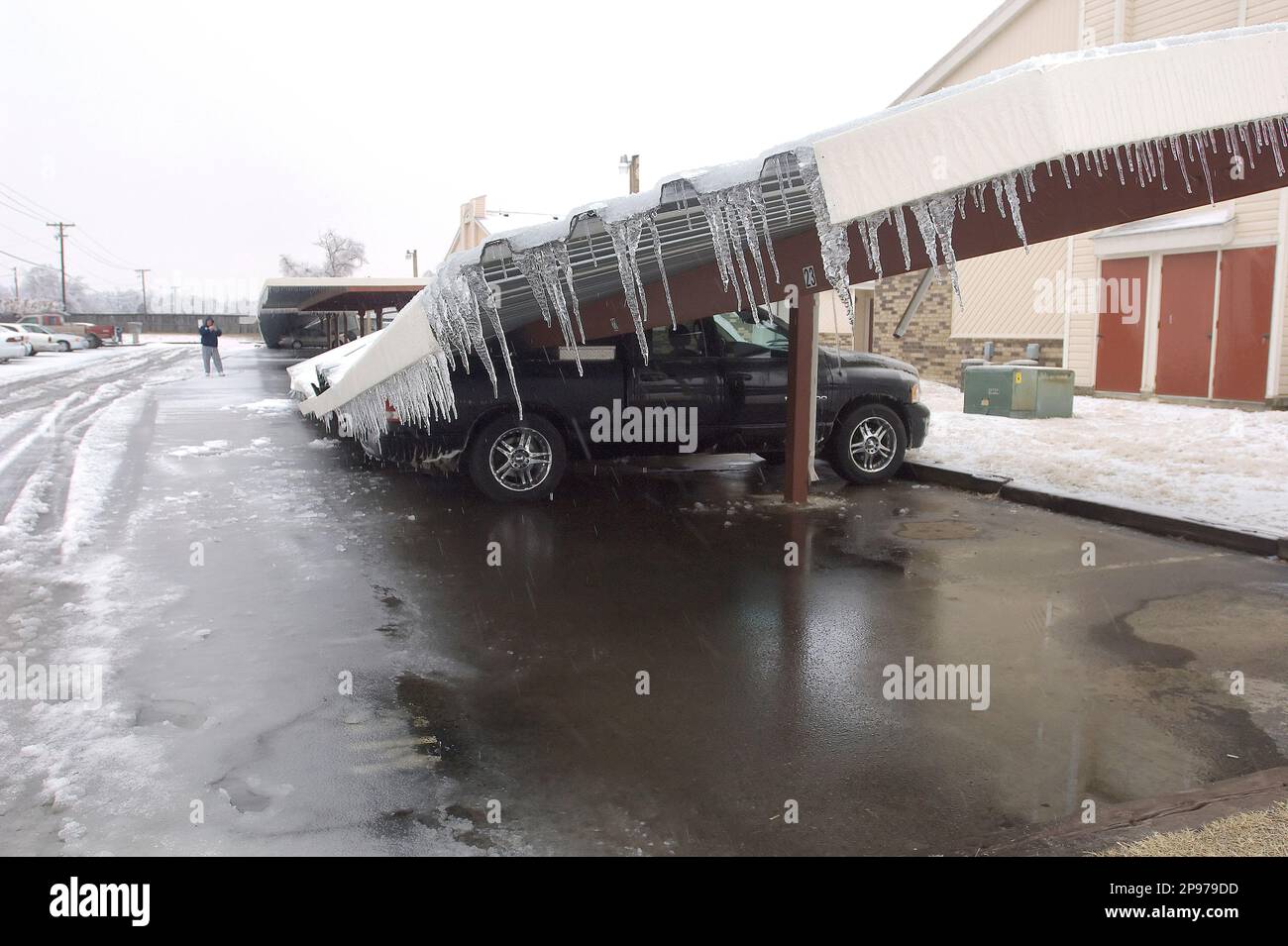 Carports buckle under a heavy sheet of ice and damage vehicles at Shady
