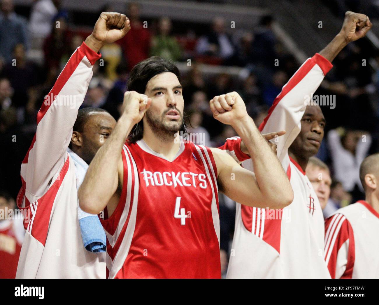 Houston Rockets' Luis Scola (4), of Argentina, celebrates a shot