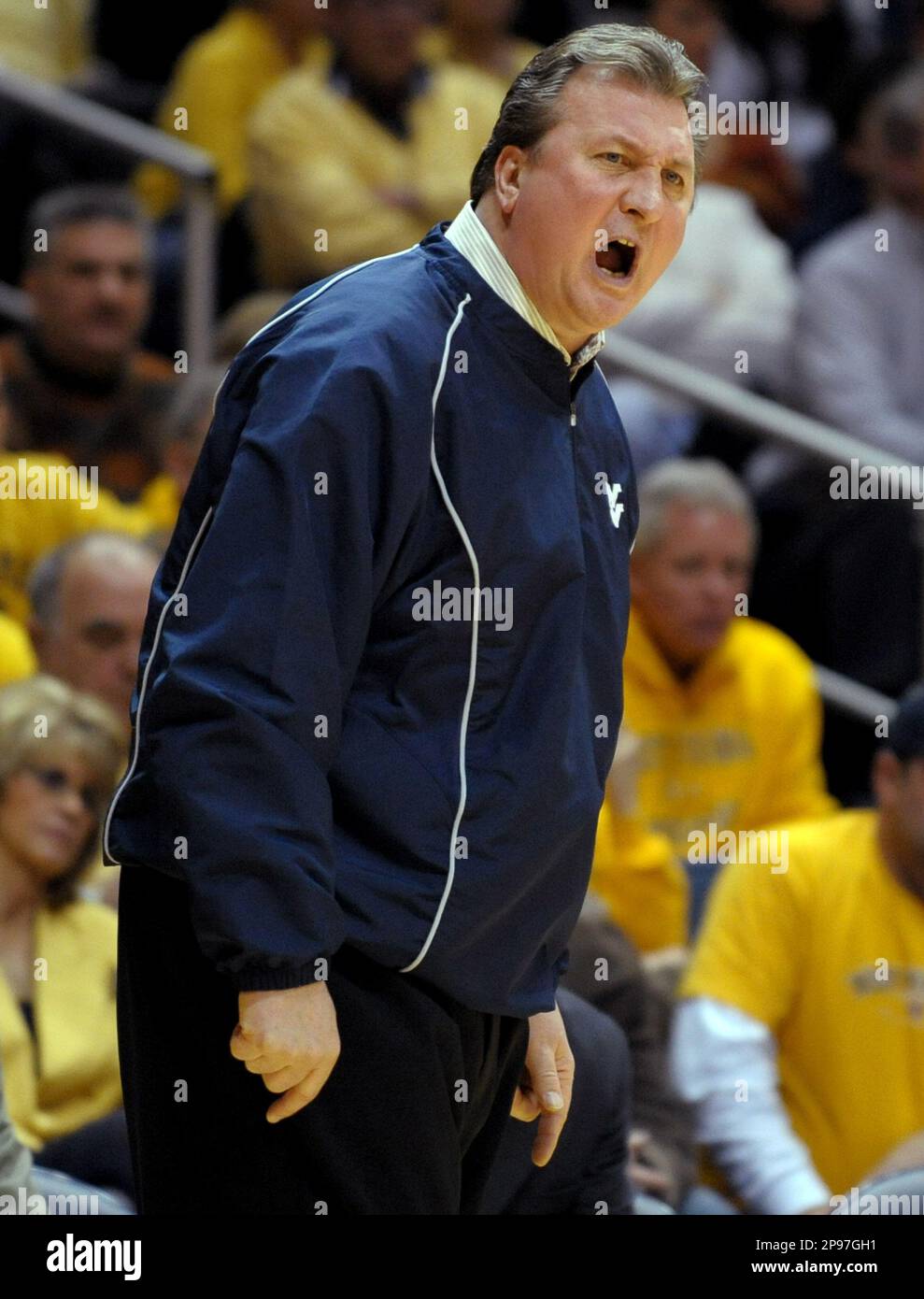 West Virginia coach Bob Huggins shouts during the first half of an NCAA