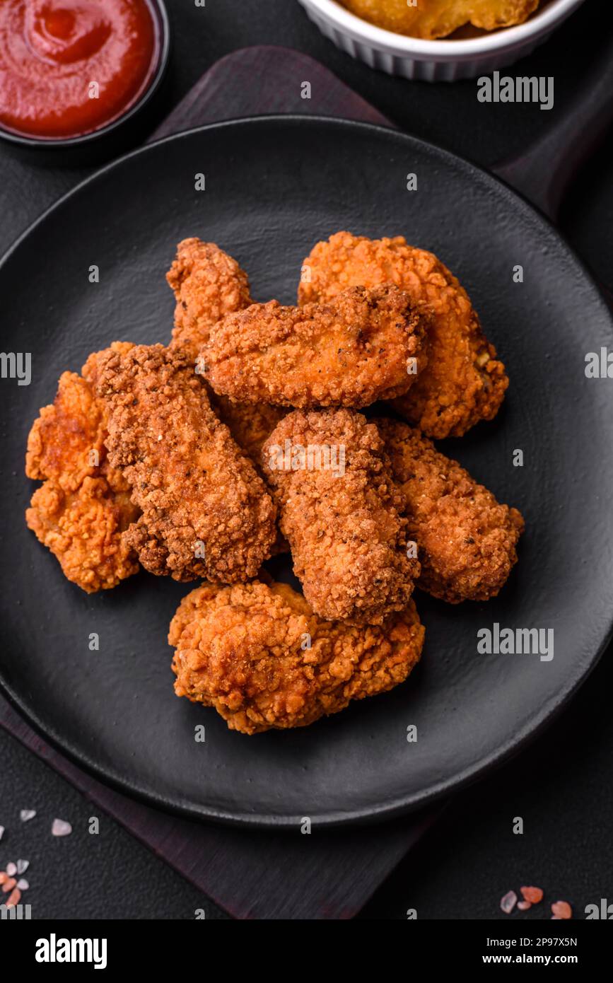 Delicious crispy breaded chicken wings grilled with spices and herbs on