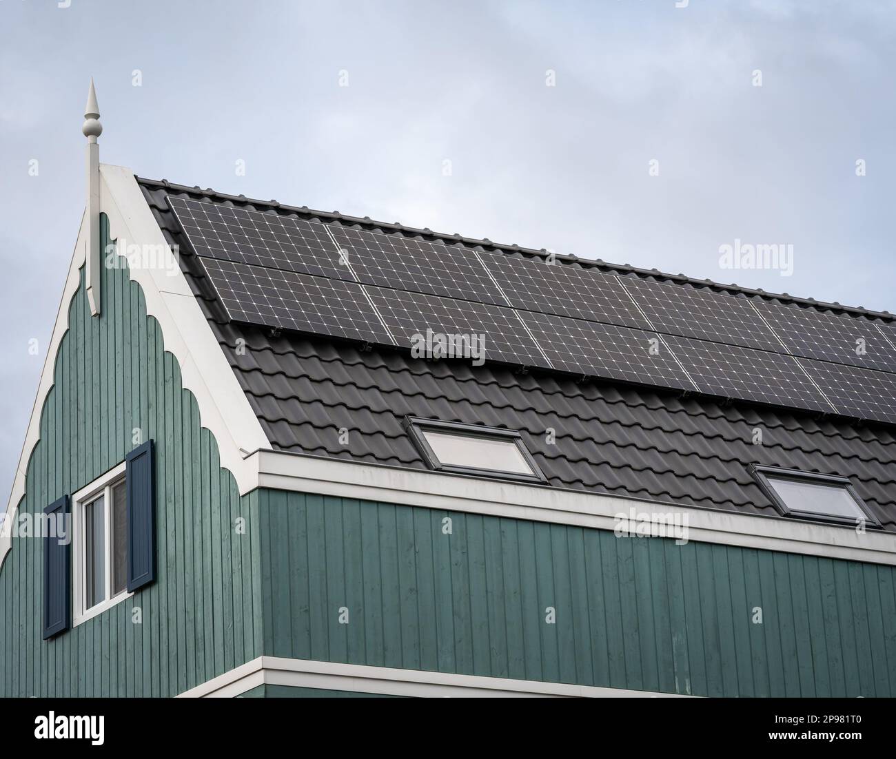 Facade of modern dutch house with solar panels, photovoltaic system