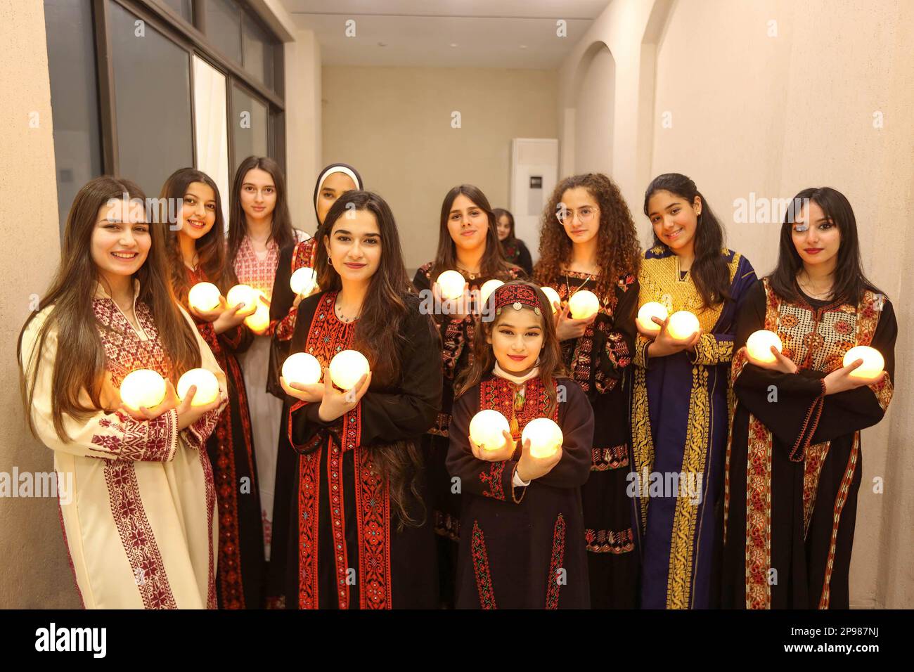 Palestinian young ladies wearing traditional embroidered dresses