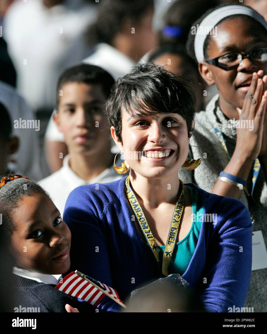 Elizabeth Raji Leslian Guity, left, joins her teacher Raquel Maldonado, center, and ...