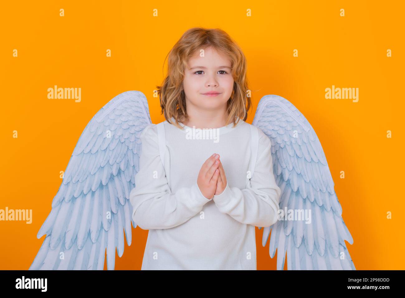 Angel prayer kids with prayer hands, hope and pray concept. Cute angel