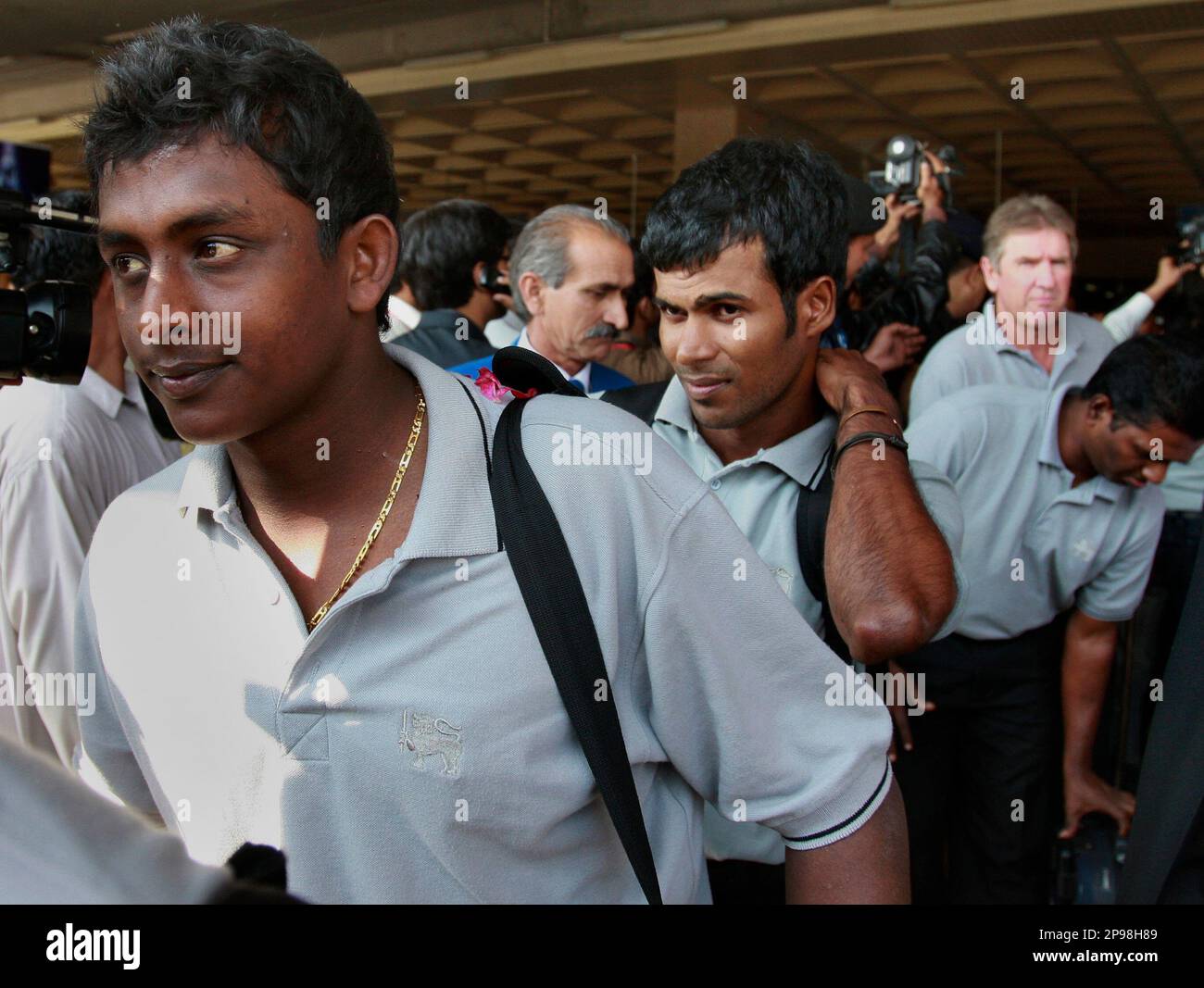 Sri Lankan cricketers Ajantha Mendis, front, and Nuwan Kulasekara, back ...