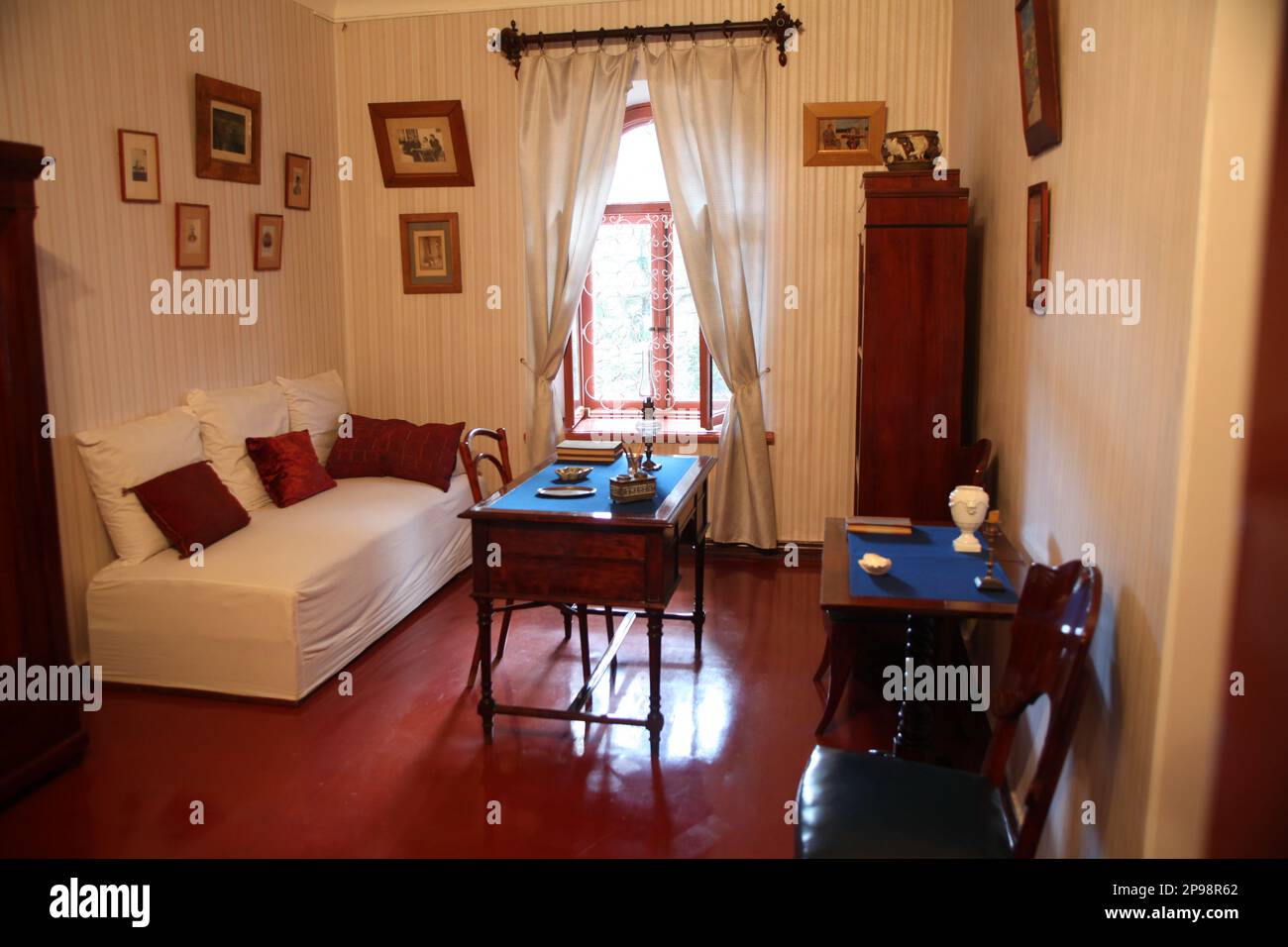Room with sofa and working table in Anton Chekhov's house in Yalta in Crimea.Chekhov enjoyed time in Crimea as it was giving him relief from tuberculo Stock Photo