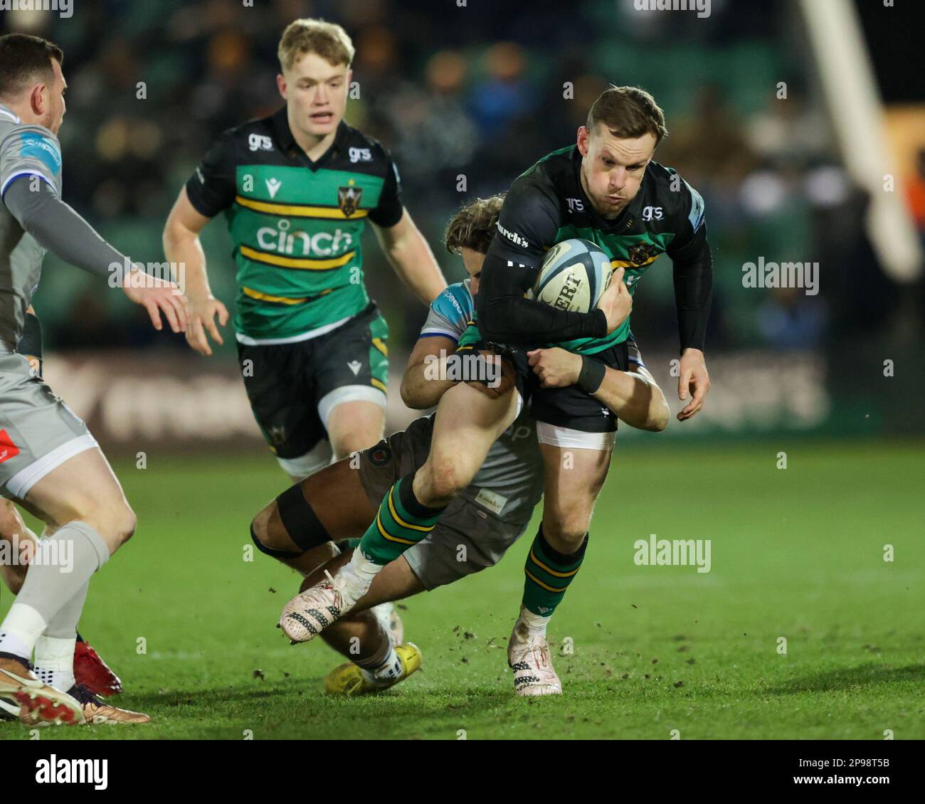 Rory Hutchinson of Northampton Saints is tackled by Tom de Glanville of Bath Rugby during the Gallagher Premiership match Northampton Saints vs Bath Rugby at Franklin's Gardens, Northampton, United Kingdom, 10th March 2023  (Photo by Nick Browning/News Images) Stock Photo