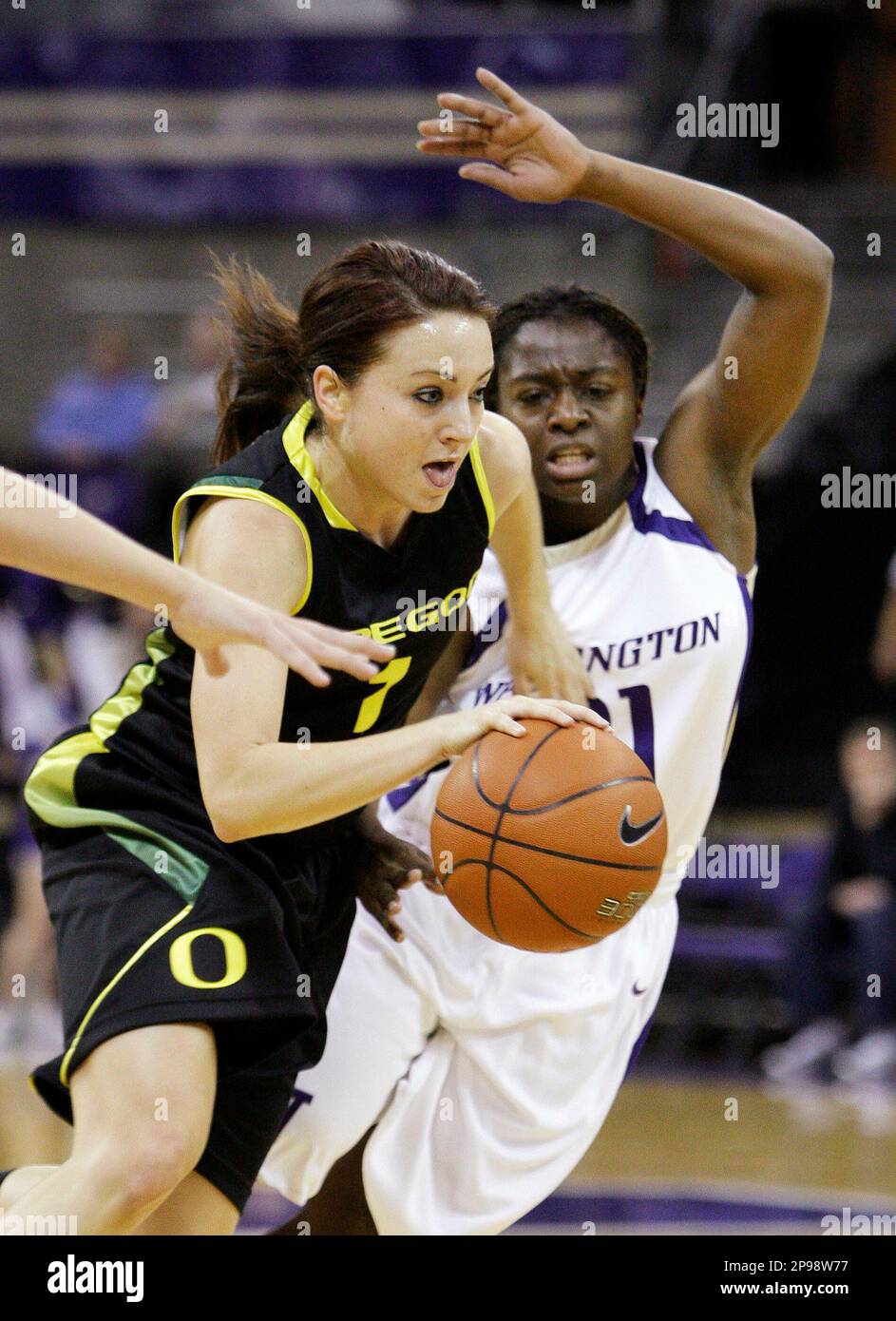 Oregon's Taylor Lilley, left, drives past Washington's Christina Rozier in  the first half of an NCAA college women's basketball game on Thursday, Jan.  15, 2009, in Seattle. (AP Photo/Elaine Thompson Stock Photo -