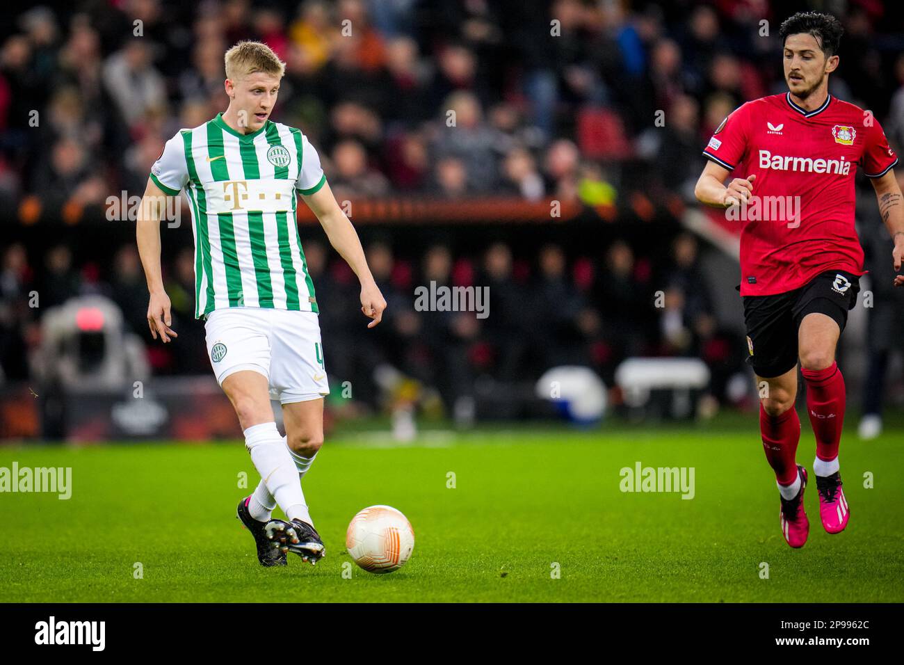 Mats Knoester of Ferencvarosi TC competes for the ball with