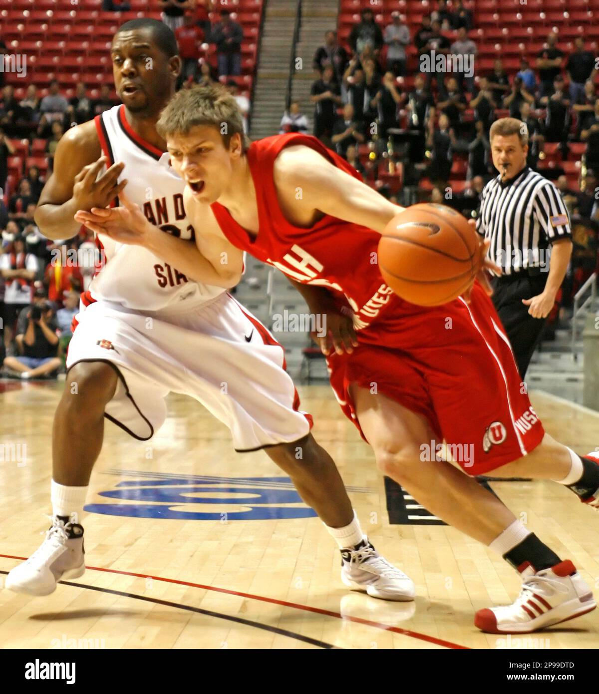 Utah's Luka Drca, right, drives to the basket past San Diego State's
