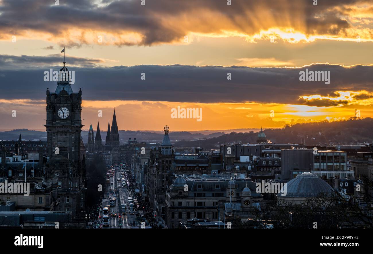 Edinburgh, Scotland, UK, 10th March 2023. UK Weather: sunset over city centre: the cold evening and low sunlight seen from Calton Hill over Princes Street and the Balmoral Hotel clock tower. Credit: Sally Anderson/Alamy Live News Stock Photo