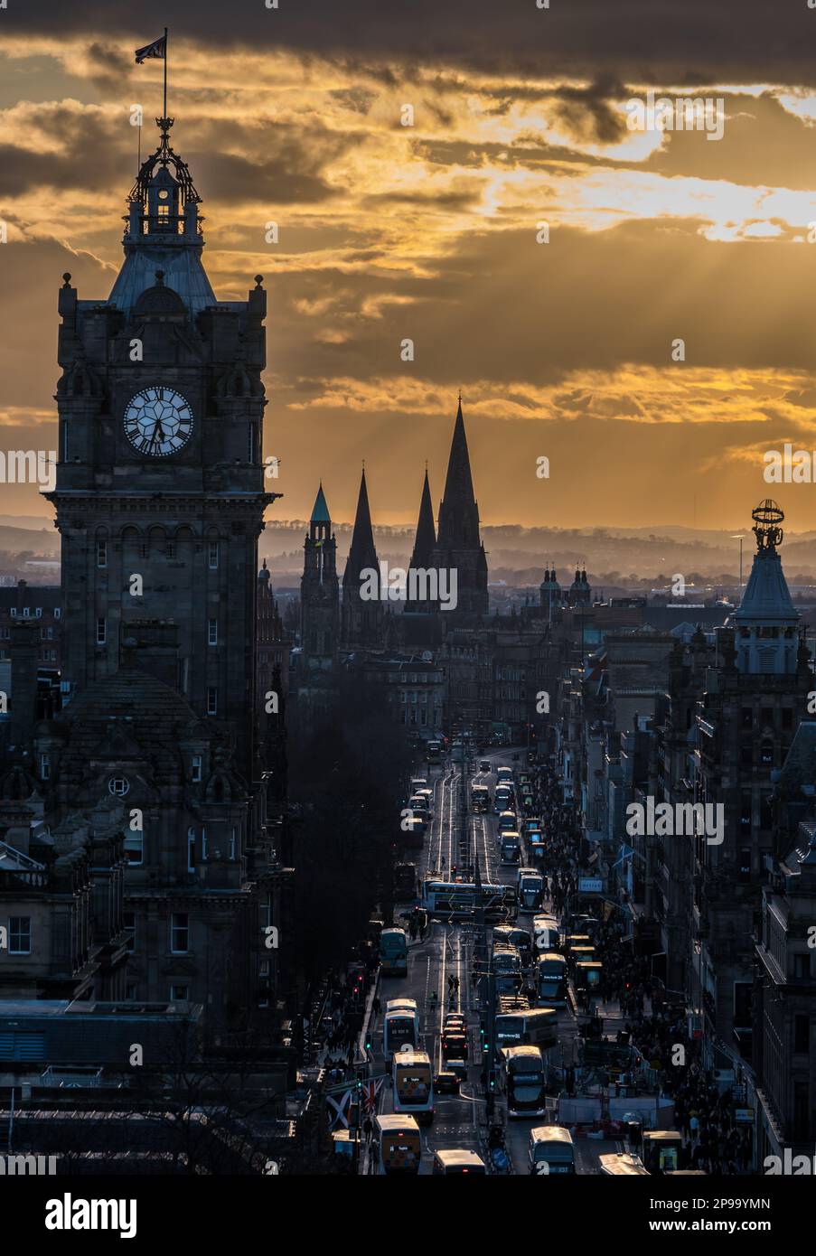 Edinburgh, Scotland, UK, 10th March 2023. UK Weather: sunset over city centre: the cold evening and low sunlight seen from Calton Hill over Princes Street and the Balmoral Hotel clock tower. Credit: Sally Anderson/Alamy Live News Stock Photo