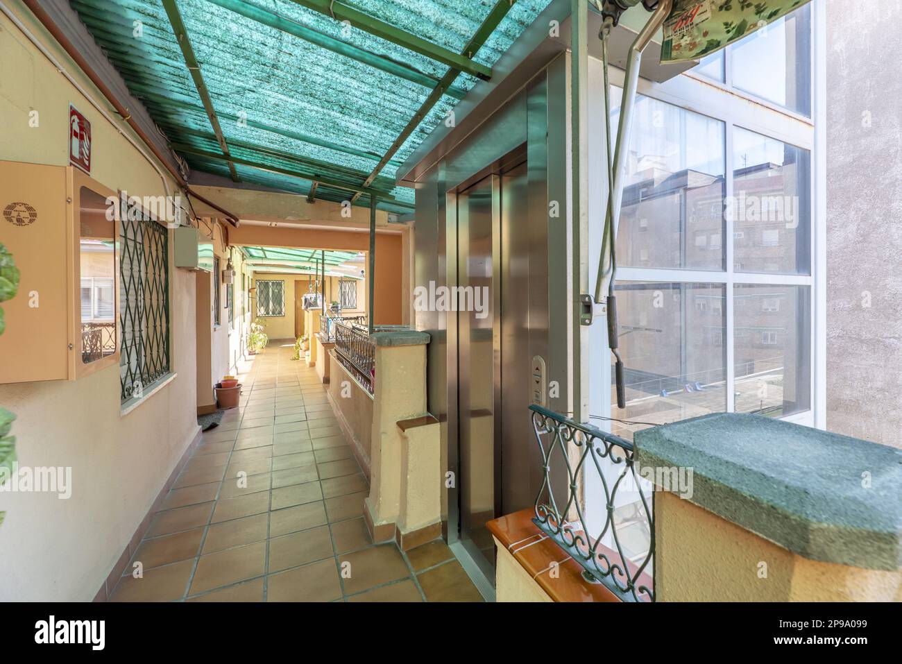 Interior corridor of a building with access to housing doors and an