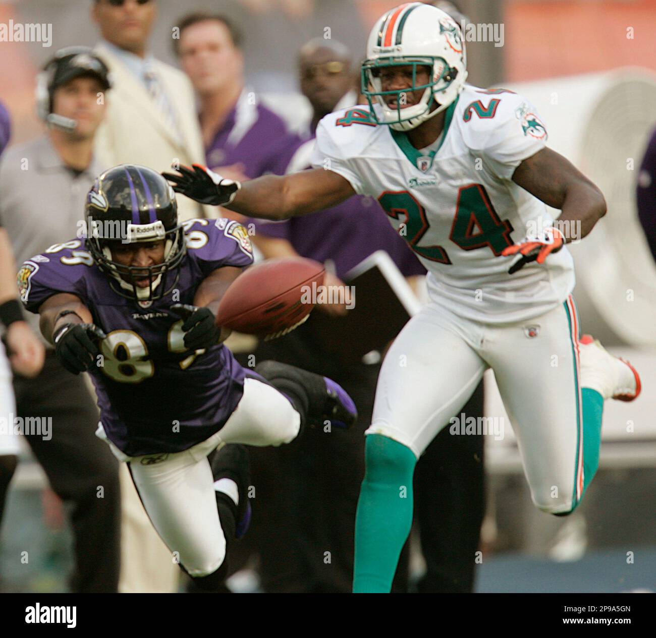 Miami Dolphins Renaldo Hill (24) applies pressure as Baltimore Ravens Mark  Clayton (89) is unable to catch a pass during the second half of their  Sunday, Jan. 4, 2009, NFL playoff football