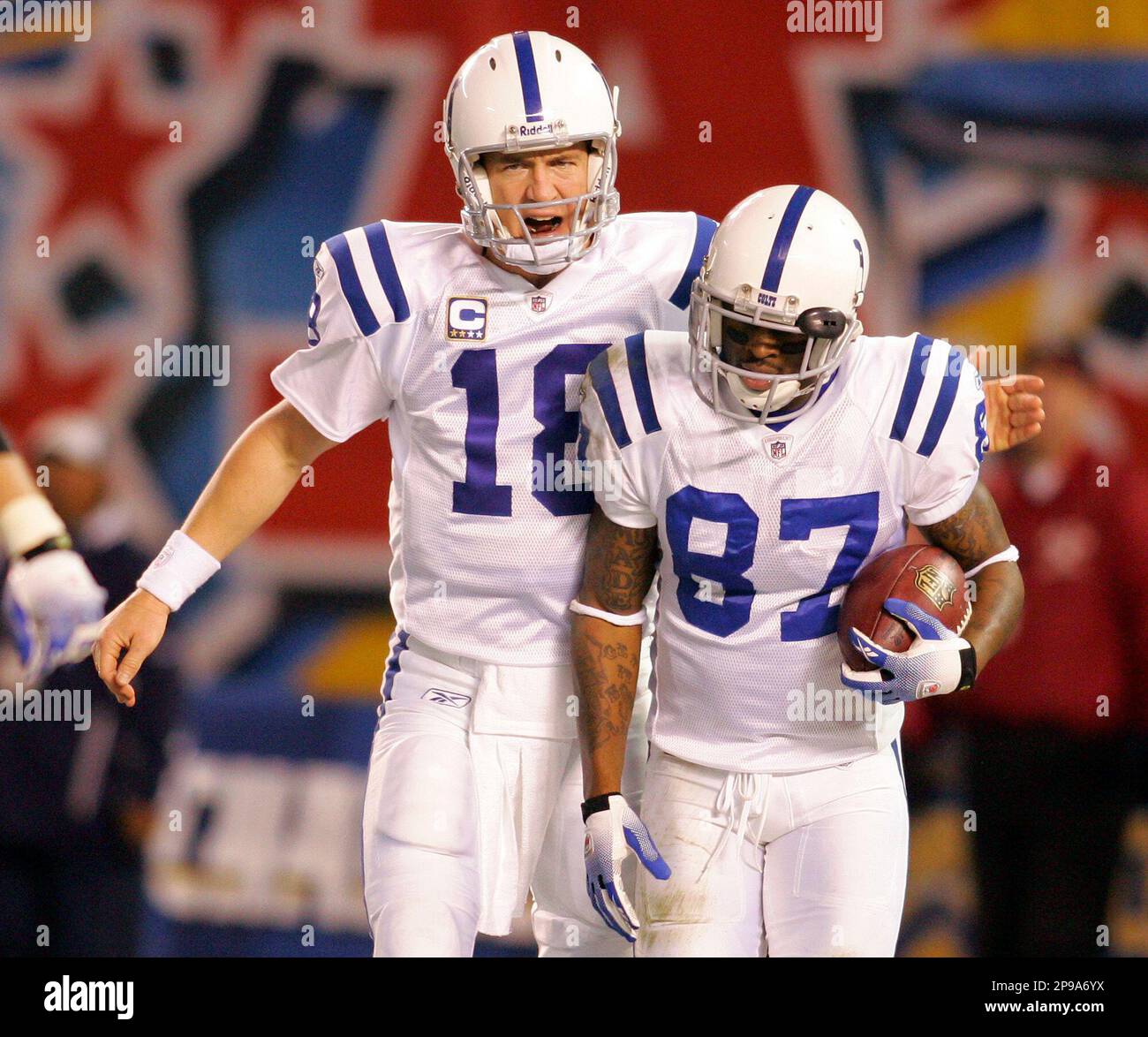 Indianapolis Colts quarterback Peyton Manning, left, greets wide