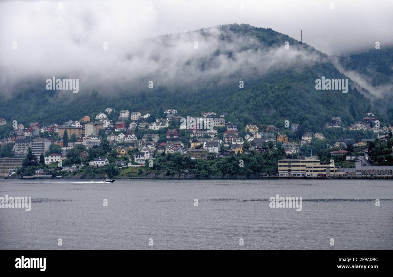 Offshore view across Vagen harbour to Torget waterfront and Mount Ulriken above historic city of Bergen, Norway, Scandinavia. 19th of July 2012 Stock Photo
