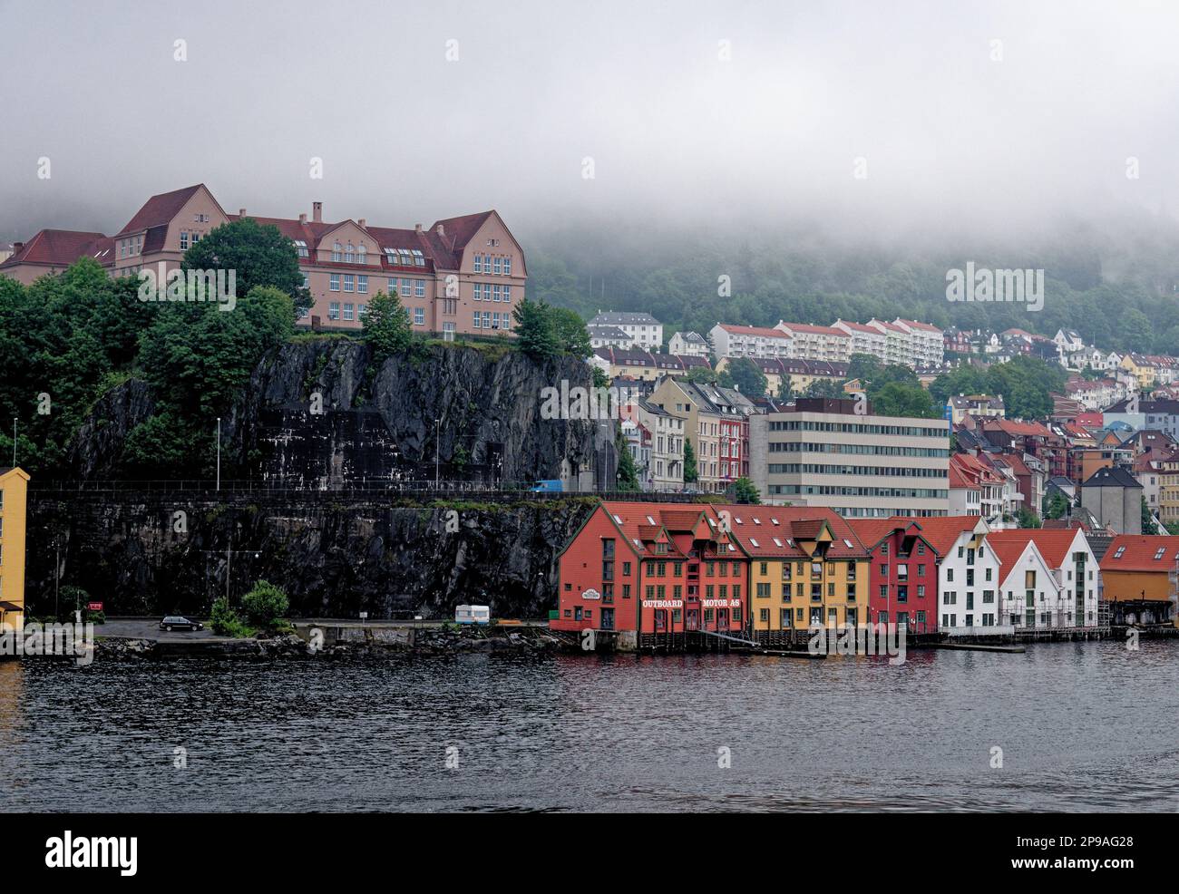 Offshore view across Vagen harbour to Torget waterfront and Mount Ulriken above historic city of Bergen, Norway, Scandinavia. 19th of July 2012 Stock Photo
