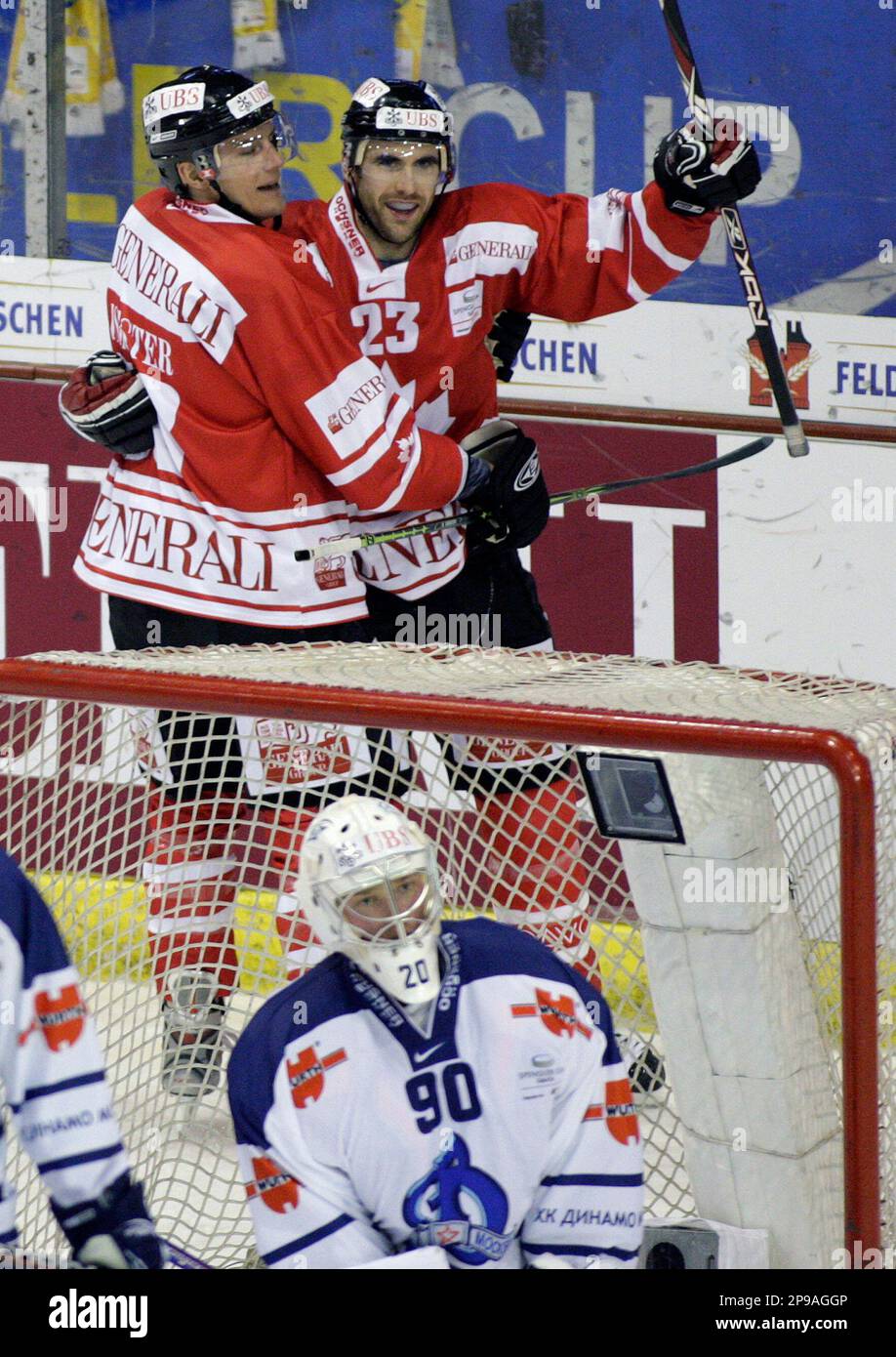 Team Canada's Brad Isbister, left, and Jay Harrison, right, celebrate a