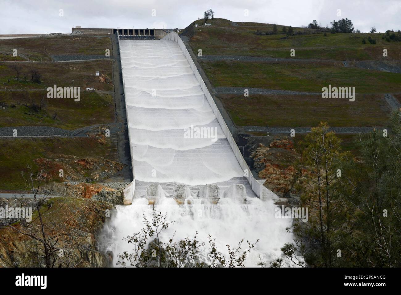Water flows down Oroville Dam's main spillway in Oroville, Calif