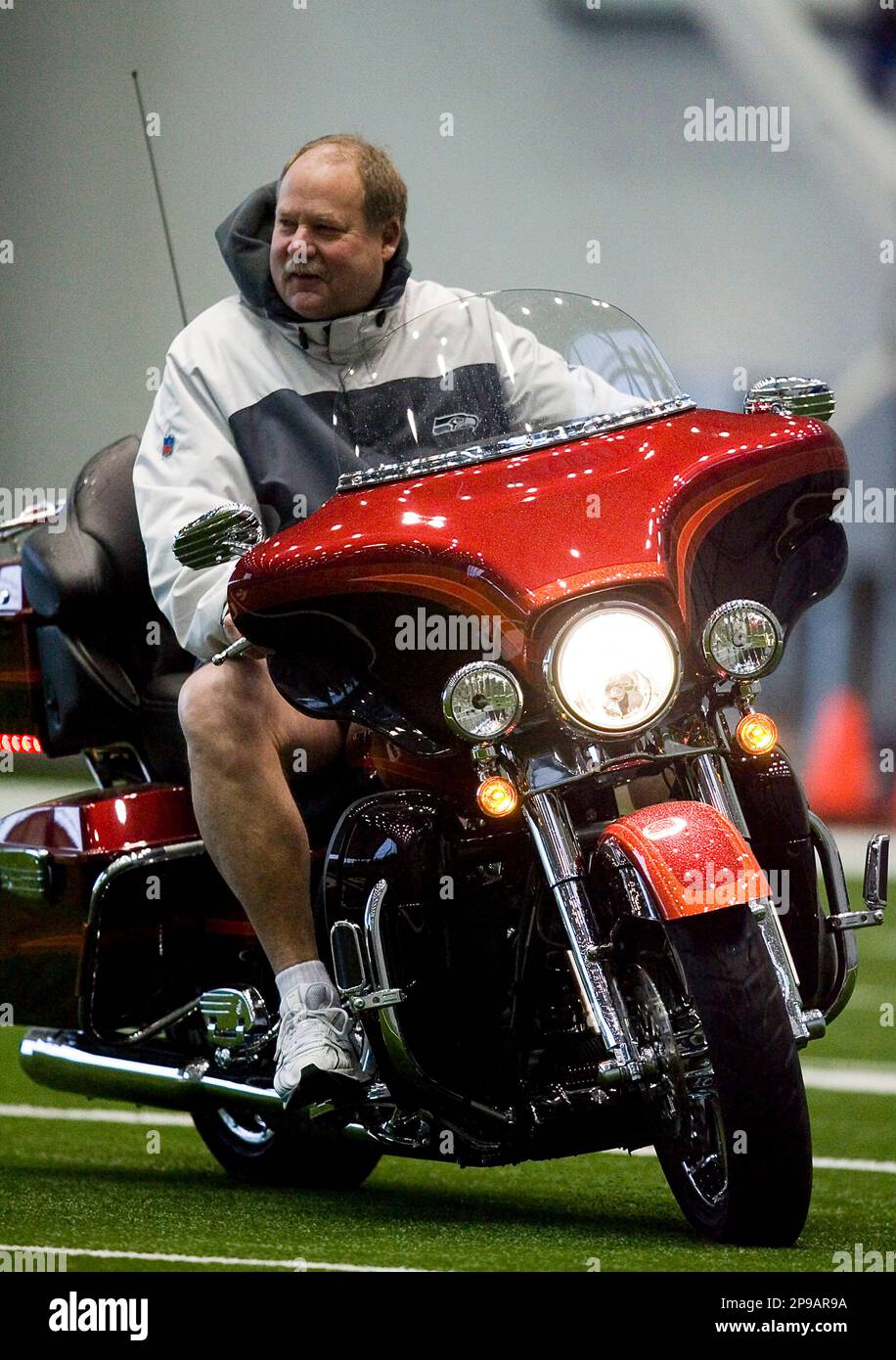 Seahawks head coach Mike Holmgren, wearing his 1997 Super Bowl XXXI Championship  ring, answers questions from the media during the Seattle Seahawks' Superl  Bowl XL Media Day at Ford Field in Detroit