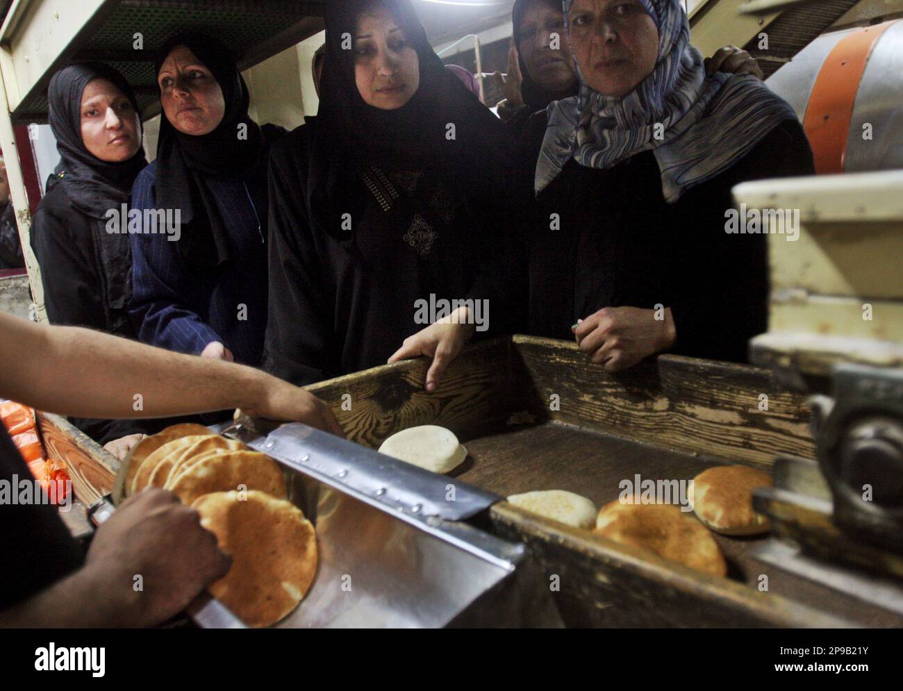 Palestinians Line Up To Buy Bread In A Bakery In Gaza City, Monday, Dec ...