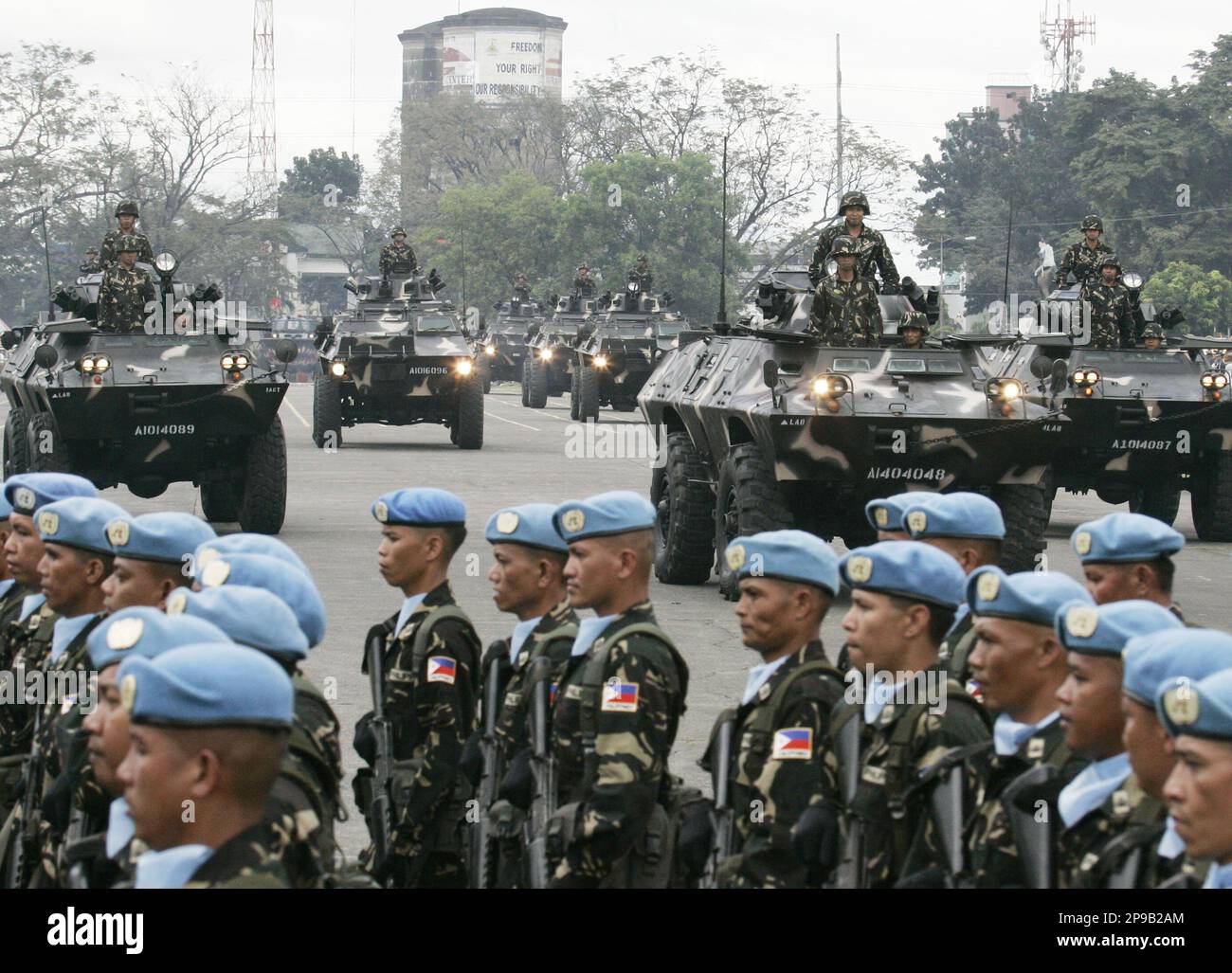 Simba armored personnel carriers roll past the grandstand during a ...
