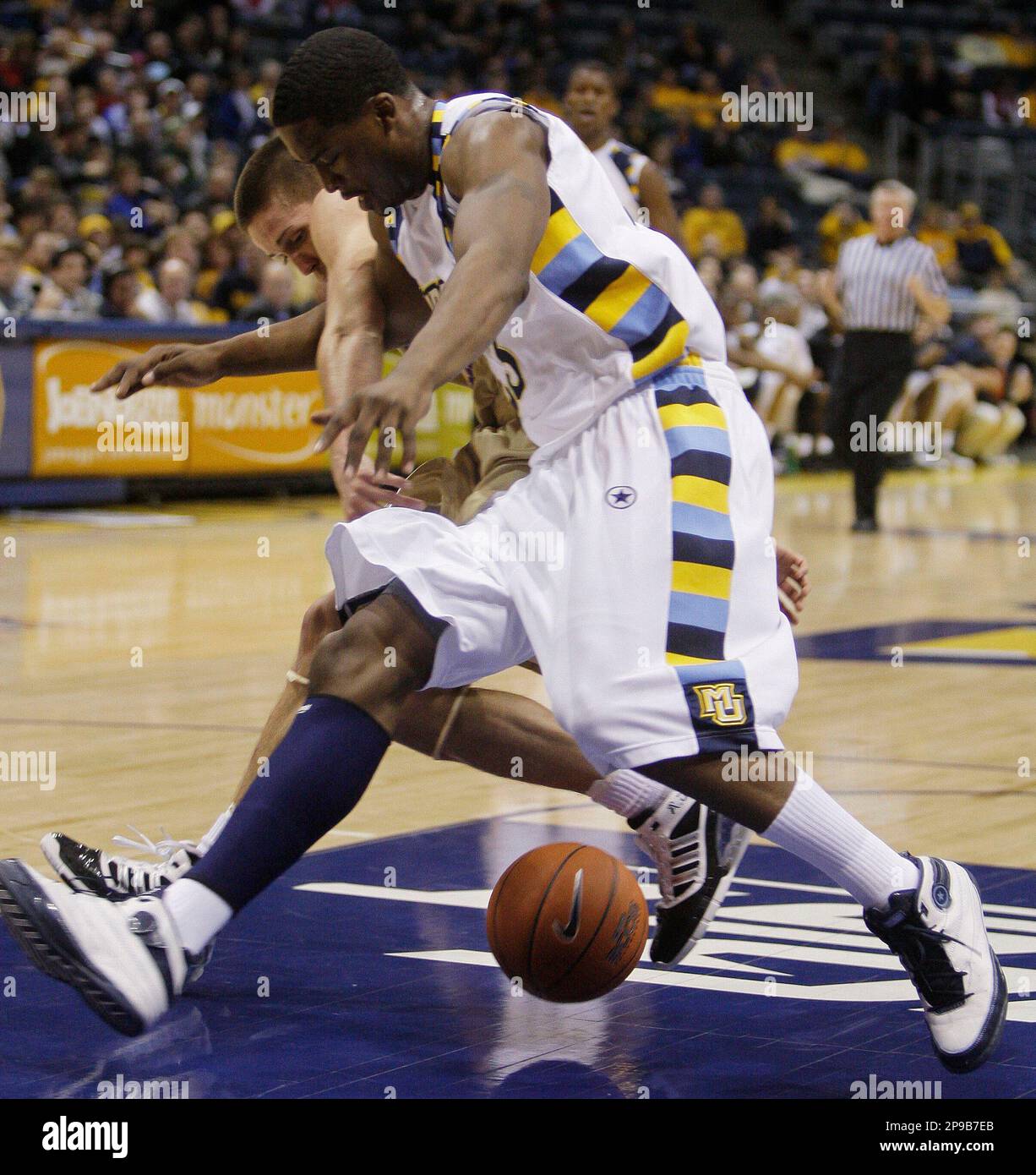 Marquette's Wesley Matthews (23) and Jake Robinson battle for a loose ball  during the first half of an NCAA college basketball game Friday, Dec. 19,  2008, in Milwaukee. (AP Photo/Morry Gash Stock