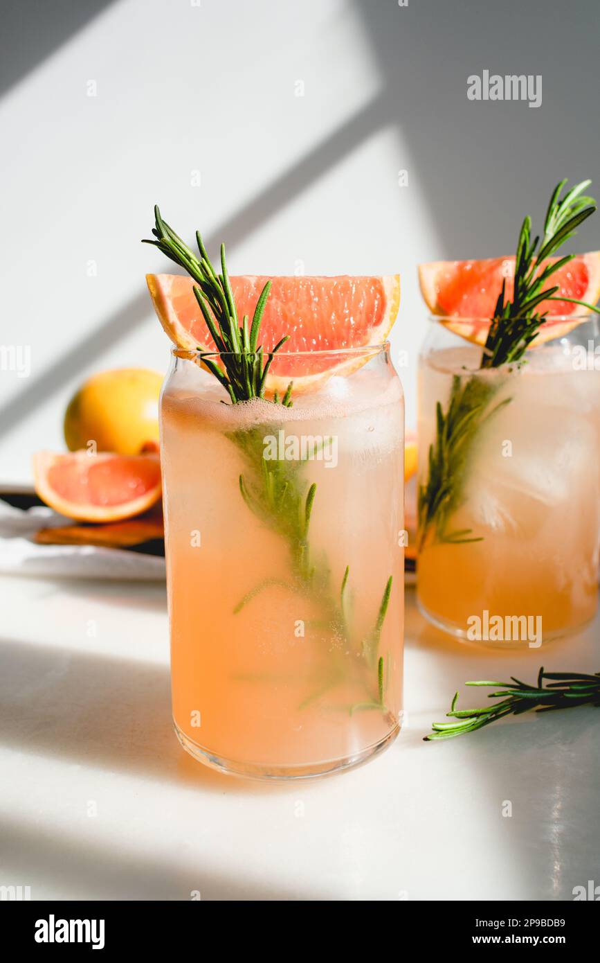 Honey Rosemary Grapefruit Sodas Garnished with Red Grapefruit