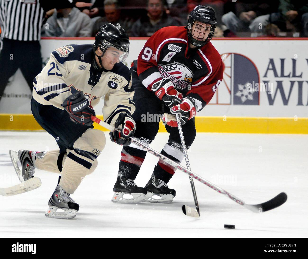 Windsor Spitfires Conor O Donnell left vies for the puck with