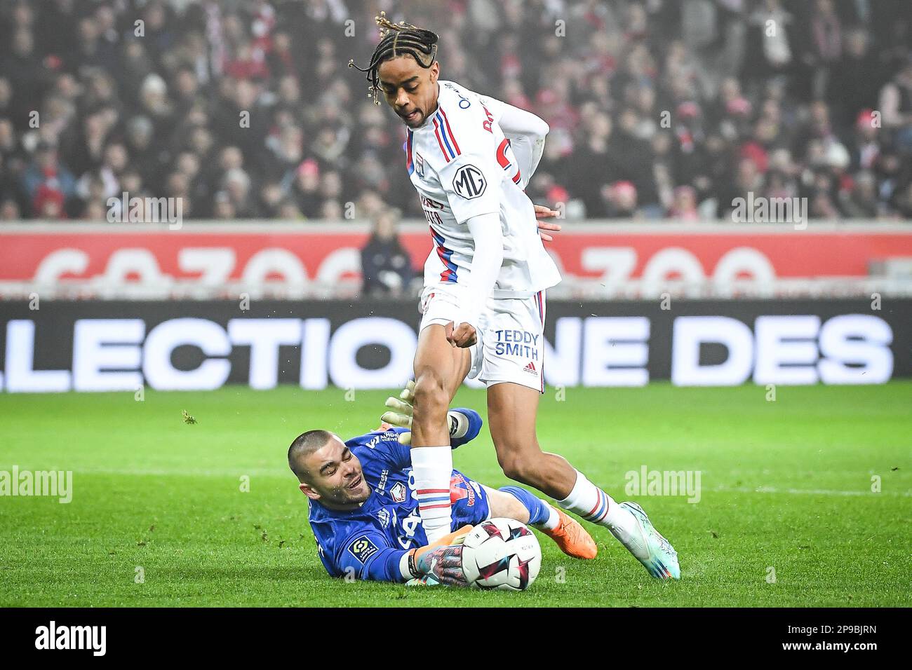 Lucas CHEVALLIER of Lille and Bradley BARCOLA of Lyon during the French  championship Ligue 1 football match between LOSC Lille and Olympique  Lyonnais (Lyon) on March 10, 2023 at Pierre Mauroy stadium