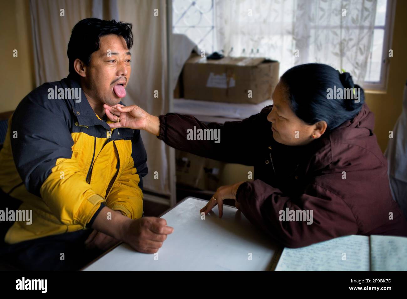 Dr Dachoe and patient in MenTseeKhang clinic.Amchi (Traditional