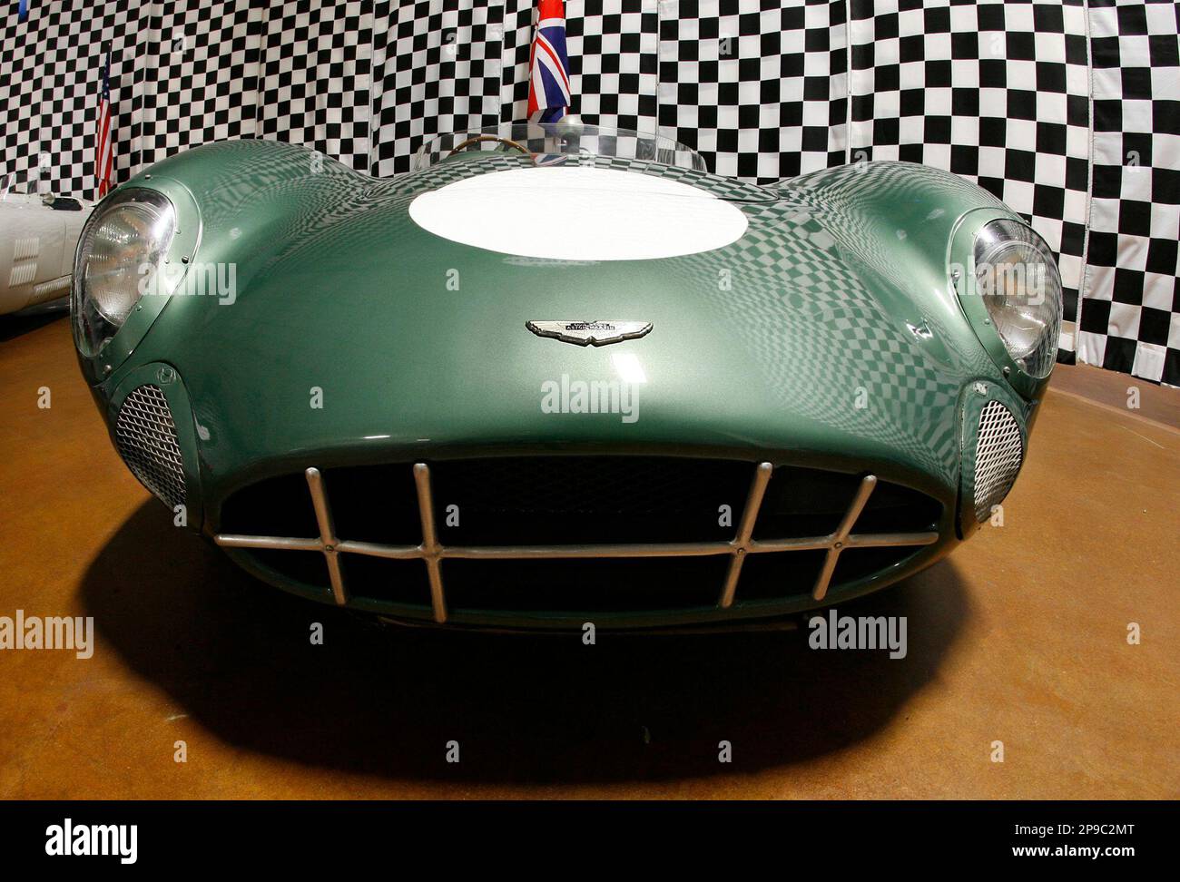 The gaping front grill of a 1958 Aston Martin DBR1 is shown in the
