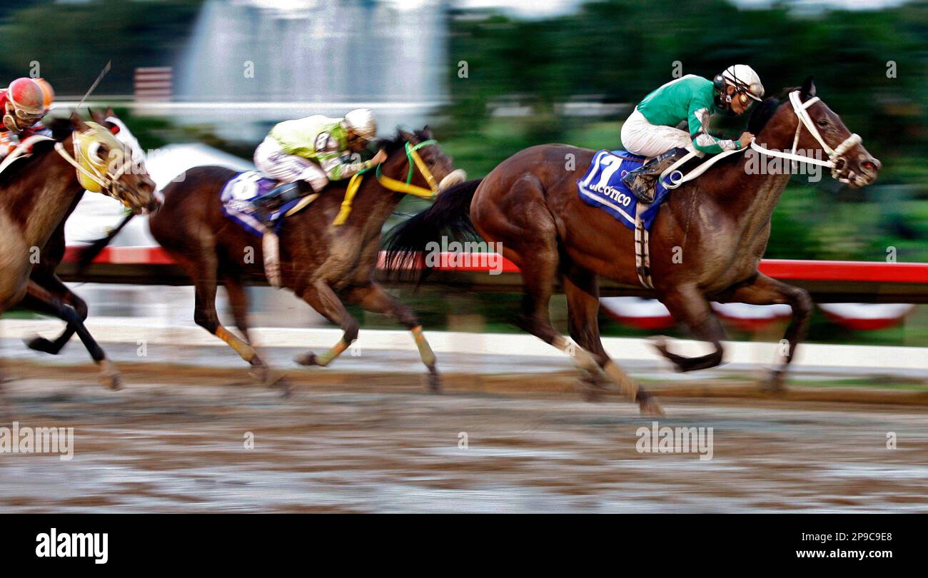 Dominican Republic's jockey Joel Rosario, right, guides to the finish