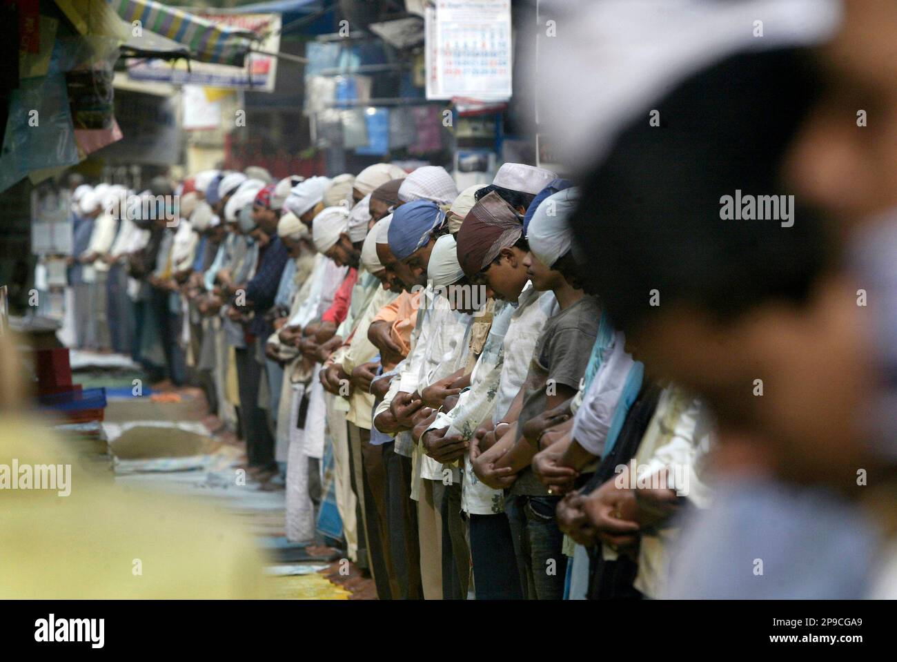 Indian Muslims perform the last Friday prayers at a mosque ahead of Eid