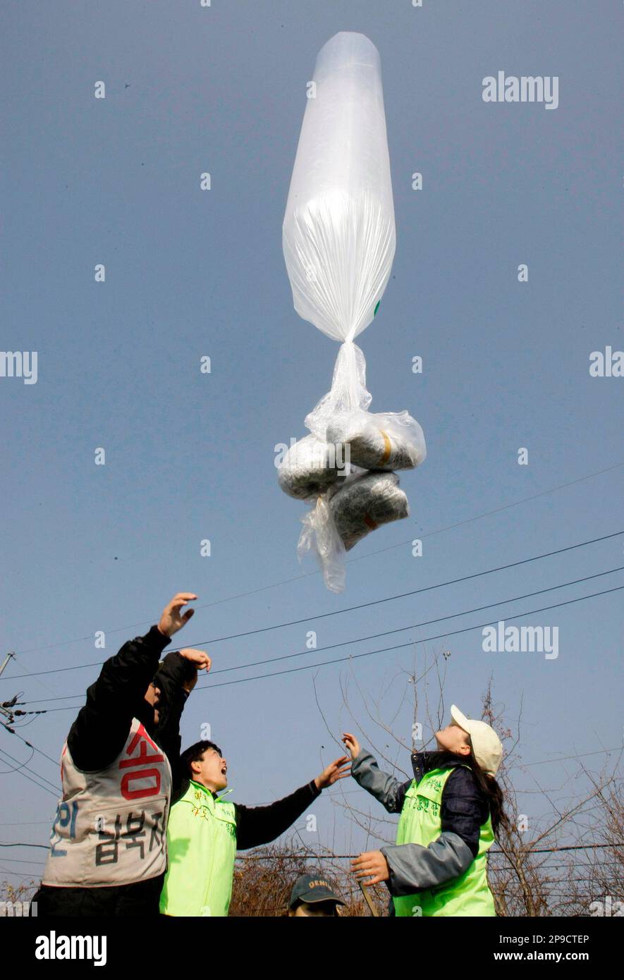 A huge helium balloon containing some leaflets, seen at bottom of ...
