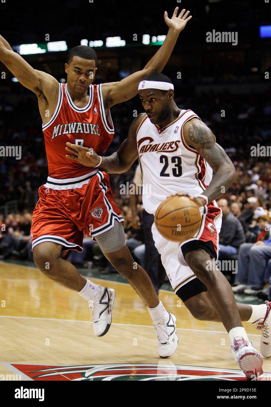 Cleveland Cavaliers' LeBron James (23) tries to drive past Milwaukee ...