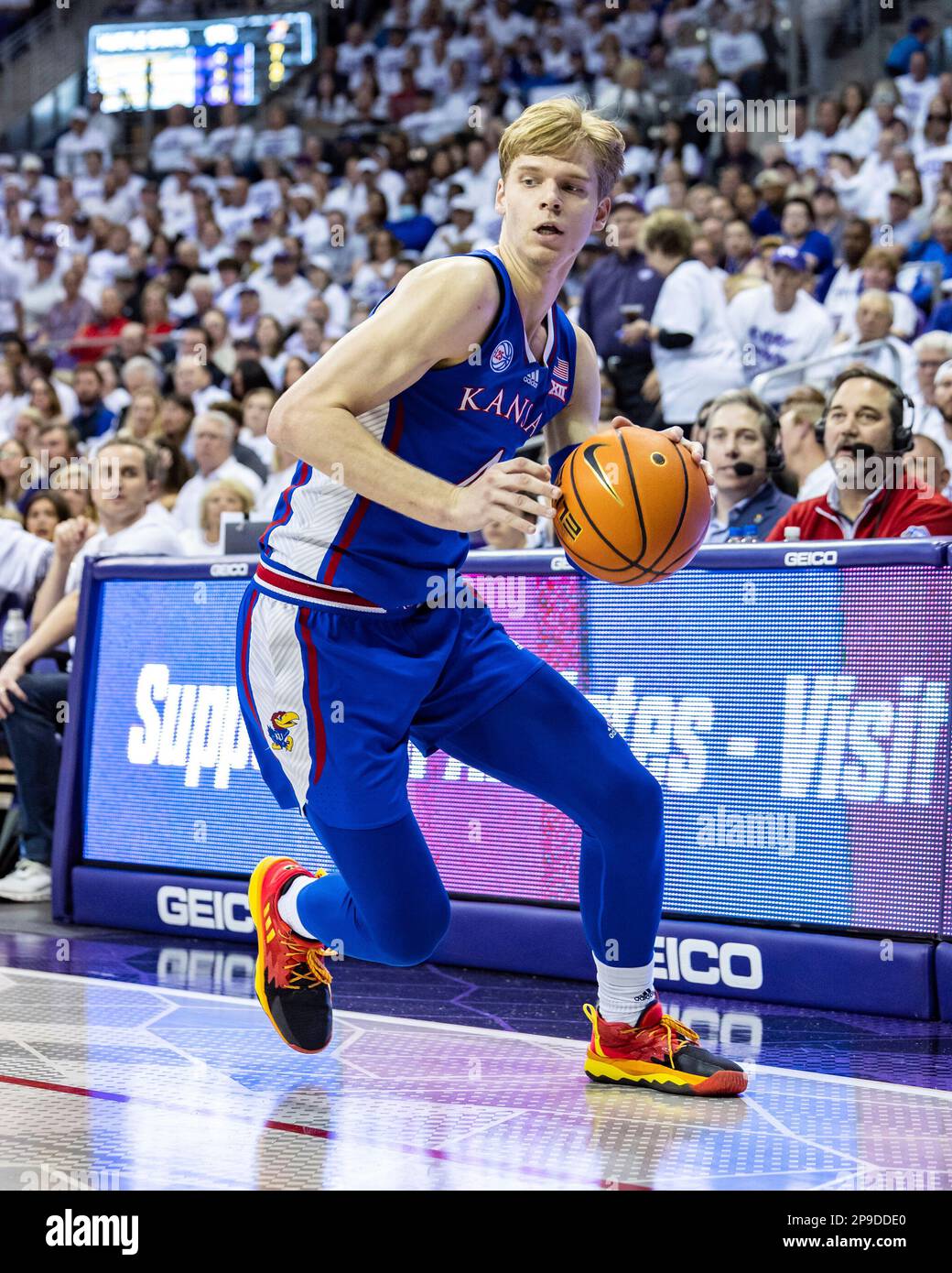 FORT WORTH, TX - FEBRUARY 20: Kansas Jayhawks guard Grady Dick (#4)  dribbles toward the basket during the college basketball game between the  TCU Horned Frogs and Kansas Jayhawks on February 20,
