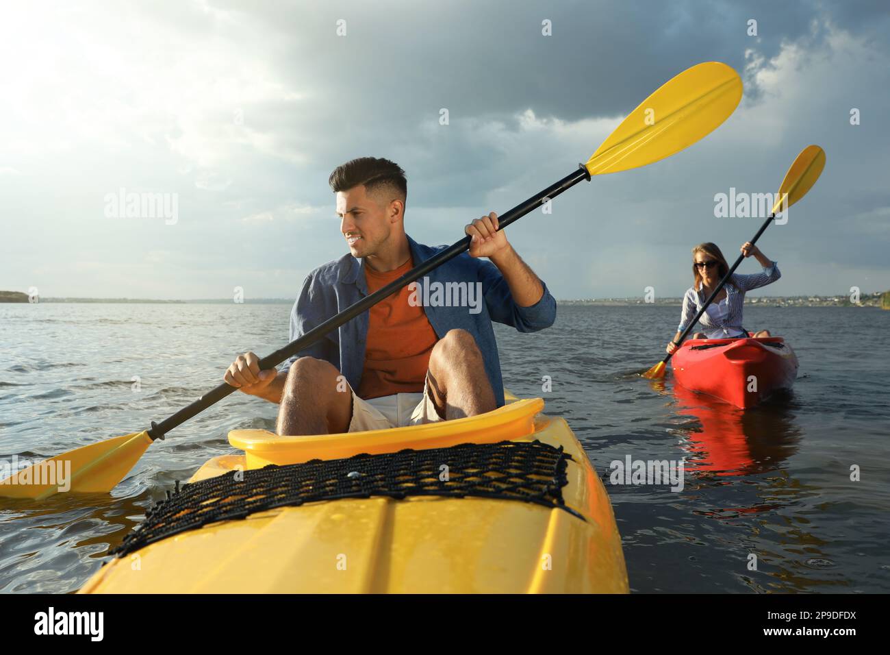 Beautiful couple kayaking on river. Summer activity Stock Photo - Alamy