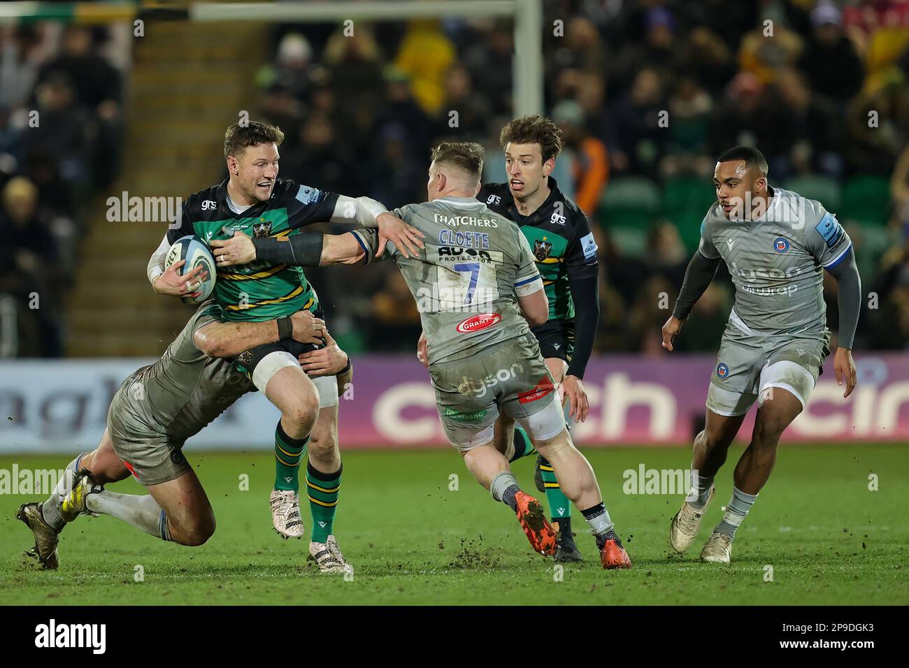 Fraser Dingwall, making his 100th appearance for Northampton Saints, is double-tackled by Tom Dunn and Chris Cloete of Bath Rugby during the Gallagher Premiership match Northampton Saints vs Bath Rugby at Franklin's Gardens, Northampton, United Kingdom, 10th March 2023  (Photo by Nick Browning/News Images) Stock Photo