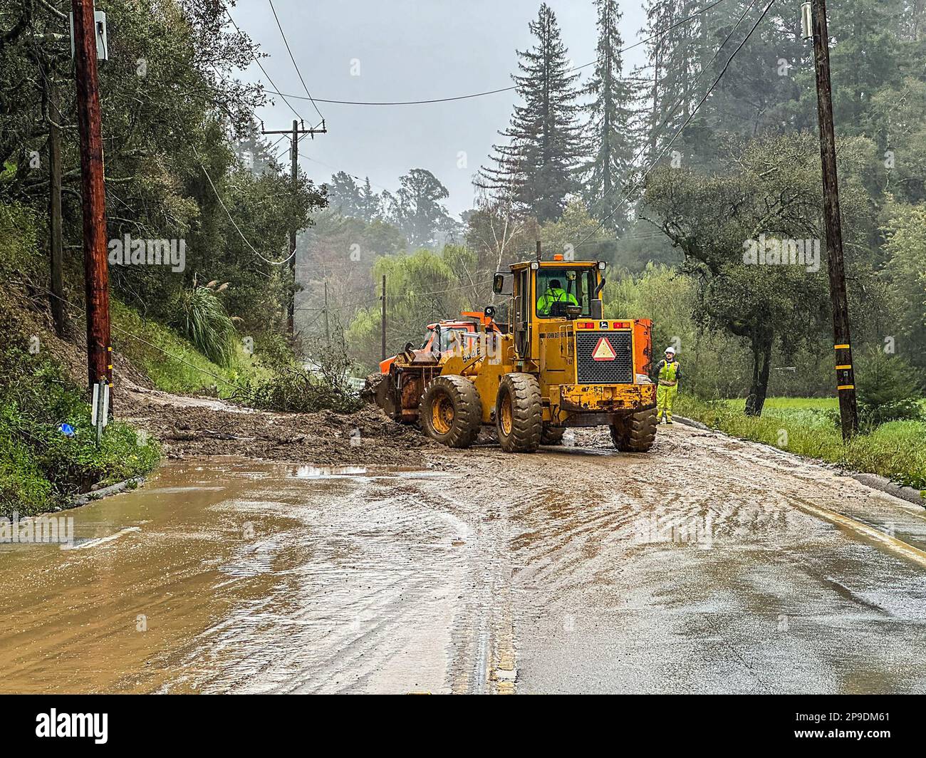 March 10, 2023, Santa Cruz County, California, USA Crews clean up a