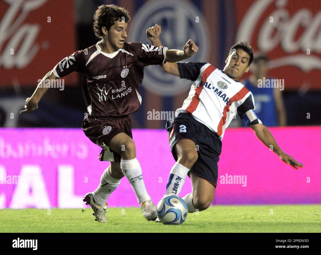 San Lorenzo de Alamgro's Adrian Gonzalez, right, fights for the ball with  Lanus' Sebastian Blanco during an Argentinean first division soccer match  in Buenos Aires, Saturday, Nov. 22, 2008. (AP Photo/Daniel Luna