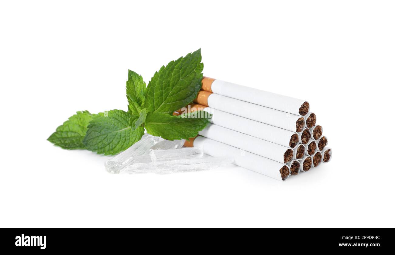 Cigarettes, menthol crystals and mint on white background Stock Photo Alamy