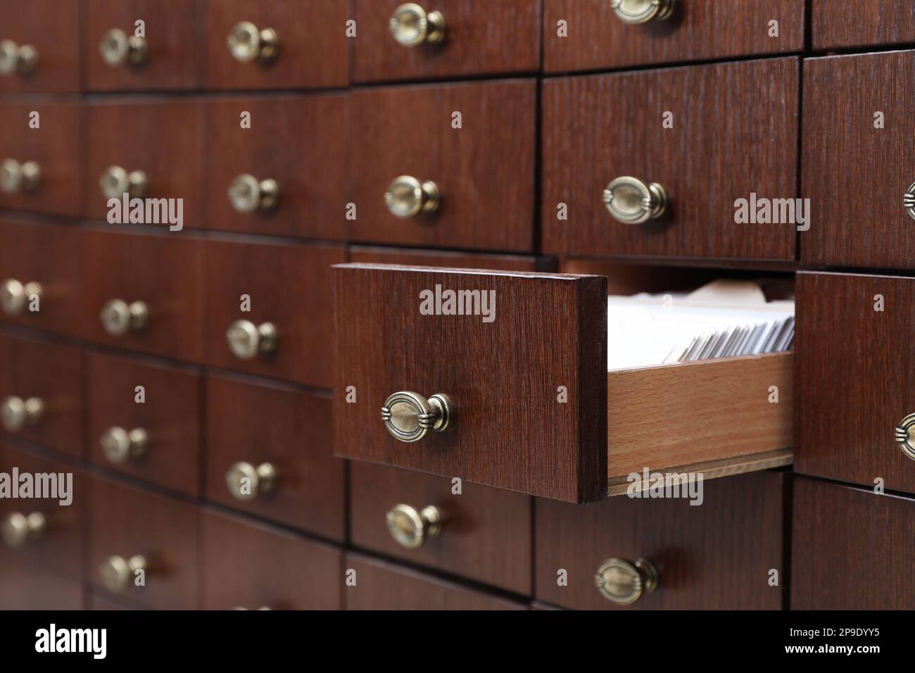 Open wooden drawer with index cards of library catalog Stock Photo Alamy